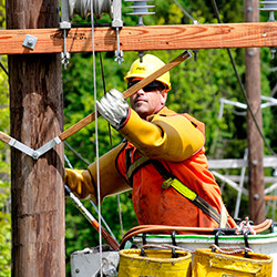  Utility worker in a bucket truck