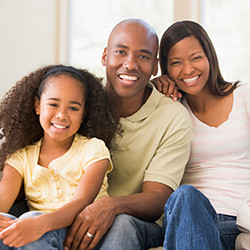 Family of three, smiling