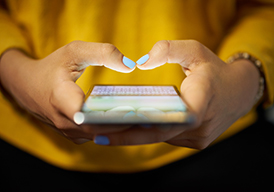 Hands holding a smart phone