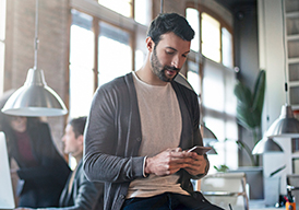 Man holding and looking at a smartphone