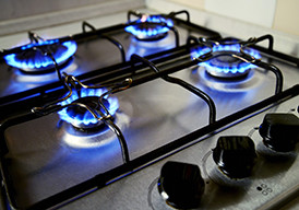 Lighted burners on a gas stove