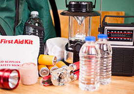 First Aid kit, bottled water, lantern, and other emergency supplies