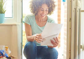 Woman Looking At Letter