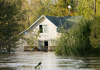Floodwaters rising up to 2nd floor of a house