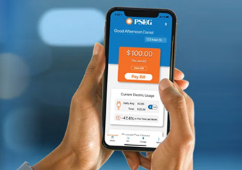 Hands holding PSE&G mobile app