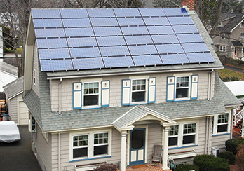 Two-story suburban home with solar panels on the roof