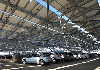 Cars parked in parking garage powered by solar energy