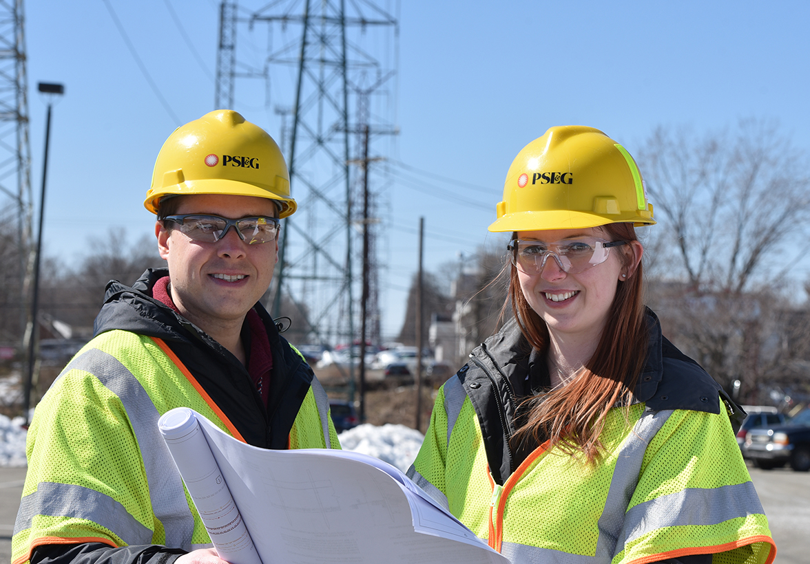 Two PSE&G technicians taking readings at electrical substation
