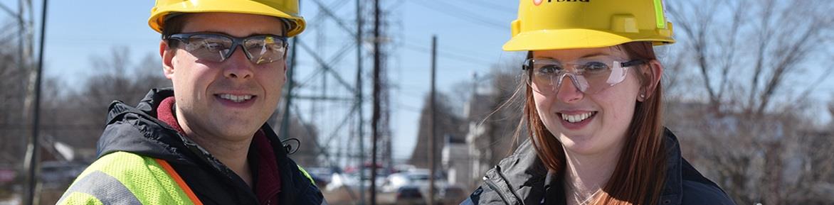 Two PSE&G technicians taking readings at electrical substation