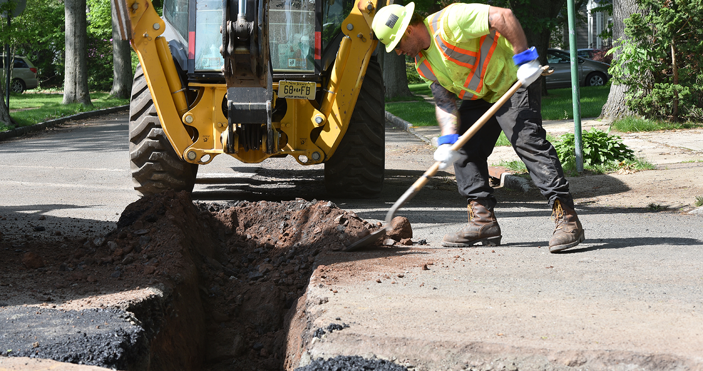 A PSE&G crew working on a road excavation