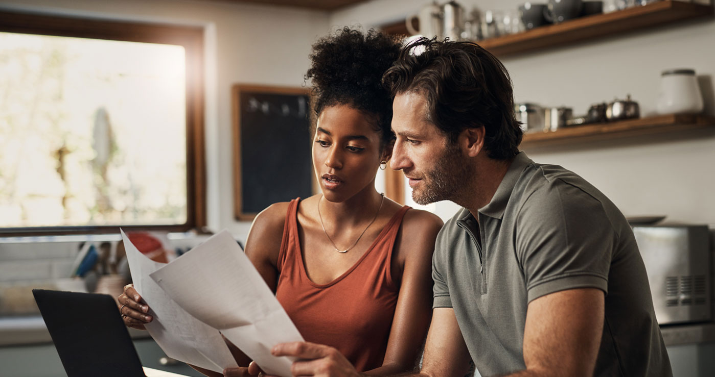 Couple Looking at Bill