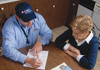 A PSE&G technician discussing a service contract with customers