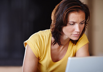 Woman looking at a laptop computer