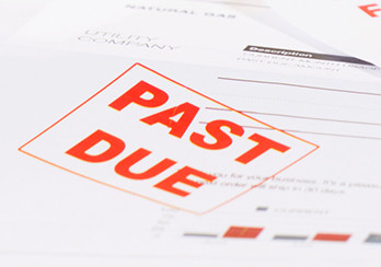 Bill with a past due stamp on it