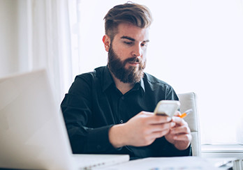 A man looking at his smartphone