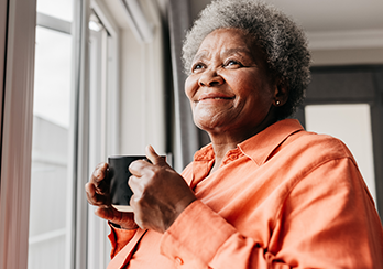Customers shown reviewing eligibility requirements for a no-cost home energy inspection and upgrades.