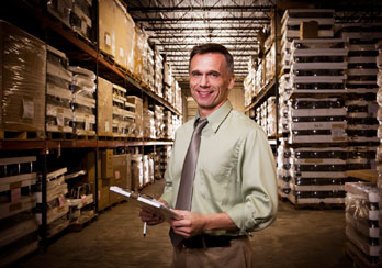 Manager in a warehouse is shown.