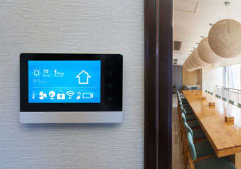 Smart thermostat next to a conference room is shown.