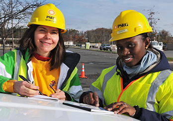 Two female workers in hard hats