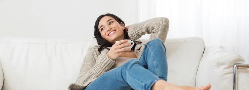  A woman lounging on a couch