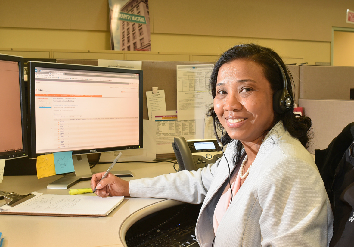 A customer service representative wearing a phone headset
