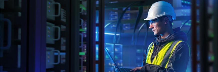 Technician looking at electric meter displays and taking notes