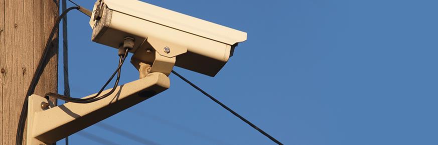 Security camera mounted on a utility pole