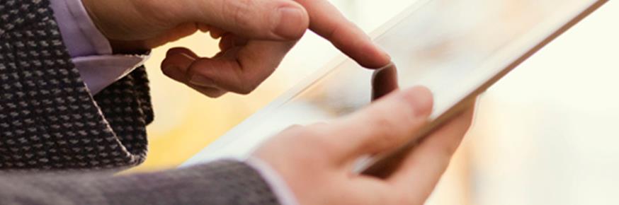 Man in suite using an iPad