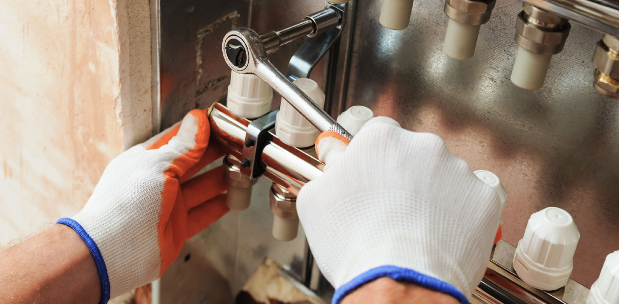 Hands using a screwdriver