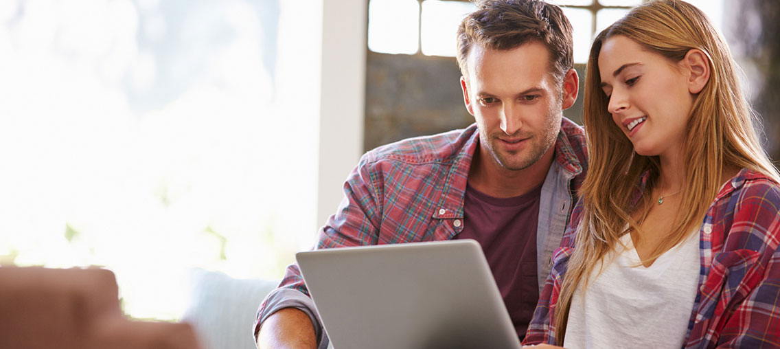 A man looking at laptop computer
