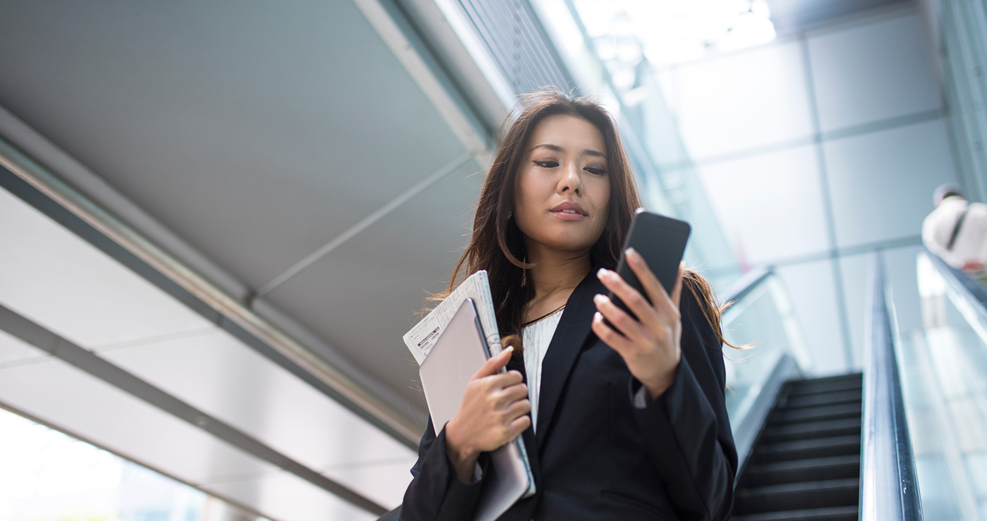 Woman managing her online PSE&G account on mobile device.