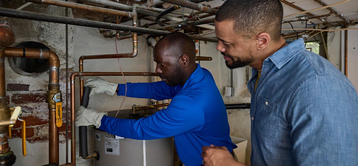 Technicians are shown performing a a free Quick Home Energy Check-up on HVAC and water heater equipment.