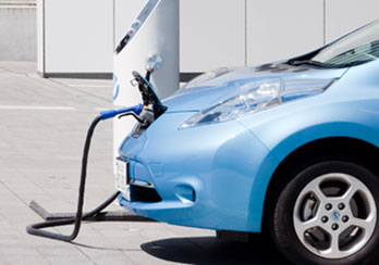 Electric vehicle being charged.